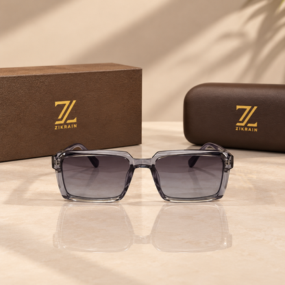 Zikrain Slay — flat-top rectangular sunglasses in smoke-grey acetate with gold temple inlay and gradient UV400 polarized lenses