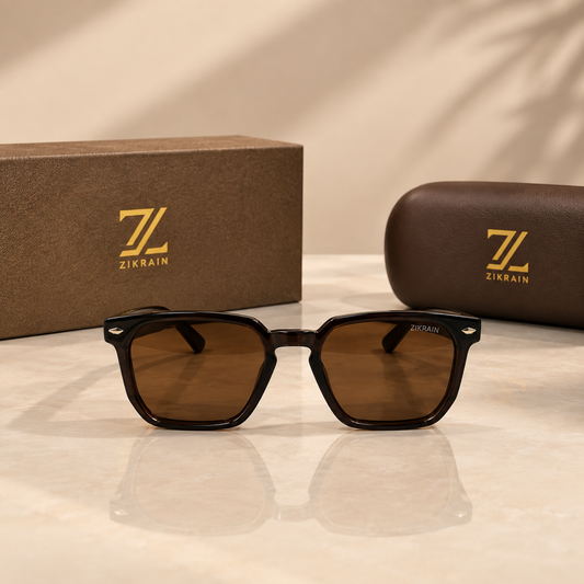 Zikrain Ember — squared sunglasses in translucent cognac acetate with gold temple emblem and brown UV400 polarized lenses
